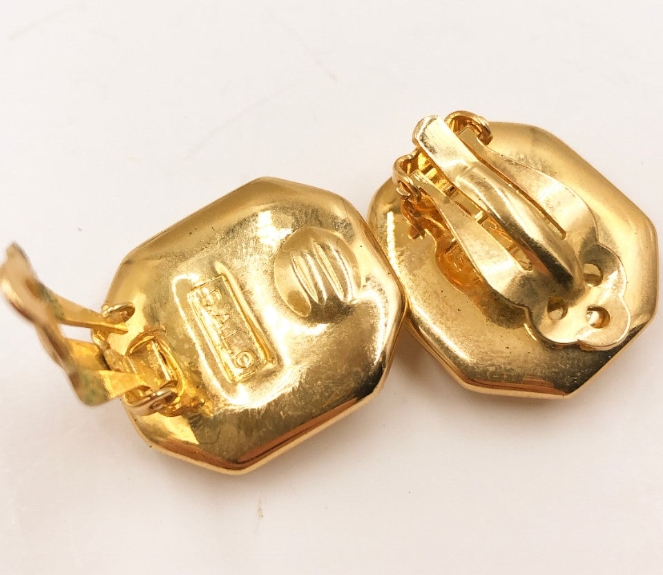 Tiny designer signed high quality clip on earrings.