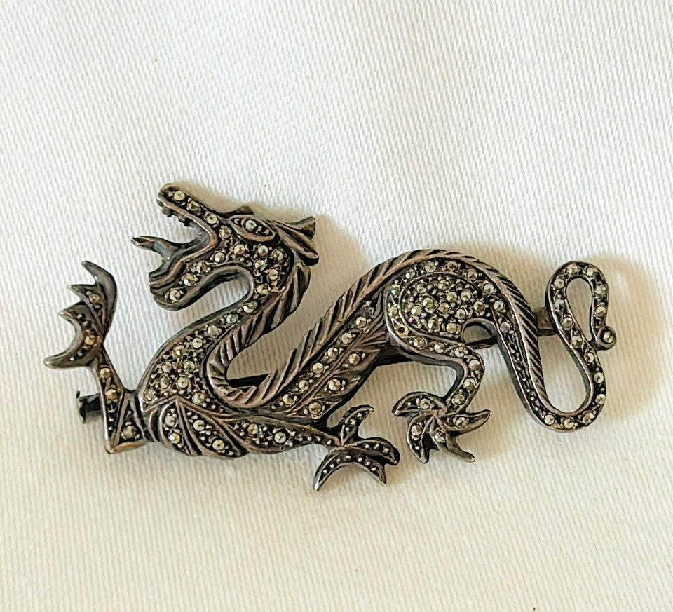 Rare chinoiserie style dragon brooch in a darker silver metal finish