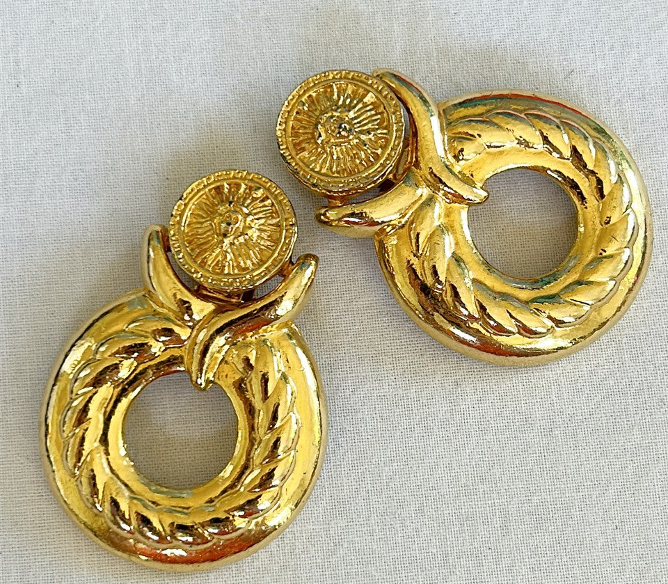 Large door knocker style early 90s clip on statement size earrings.