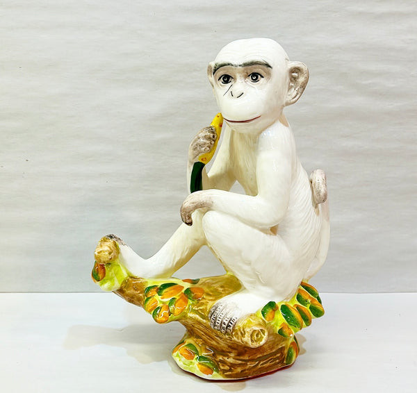 Vintage Italian decorative monkey holding banana.