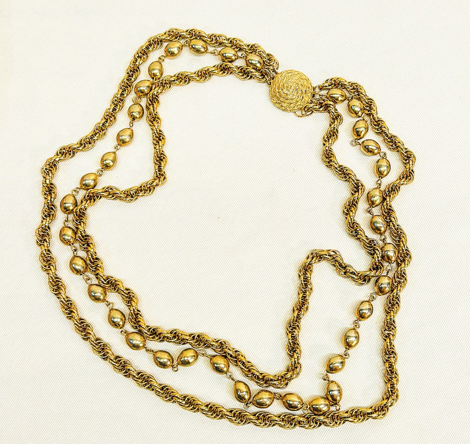 Vintage 1970s multi strand gold tone designer necklace.