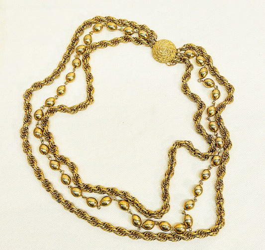 Vintage 1970s multi strand gold tone designer necklace.