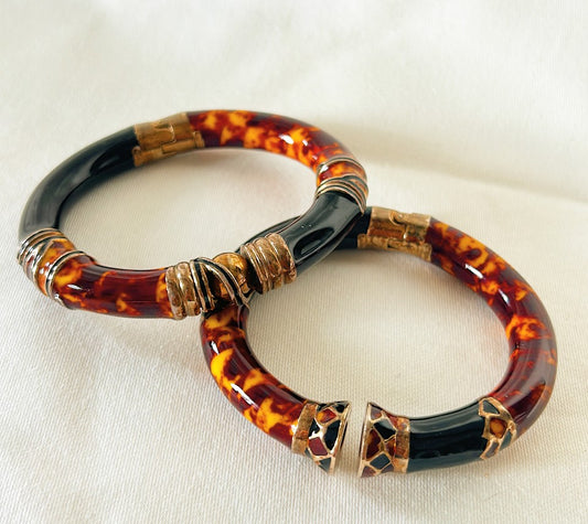 Vintage 1970s Italian made enamel tortoise and black hinged bangle bracelets.