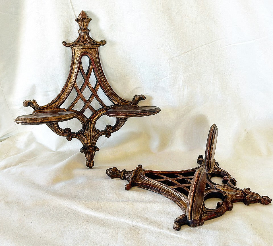 Pair of 1960s pagoda style wall mounted decorative wall shelf bracelets.