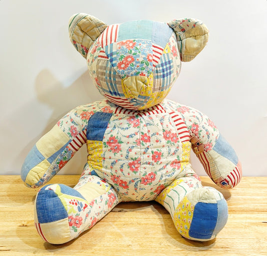 Antique quilted large teddy bear.