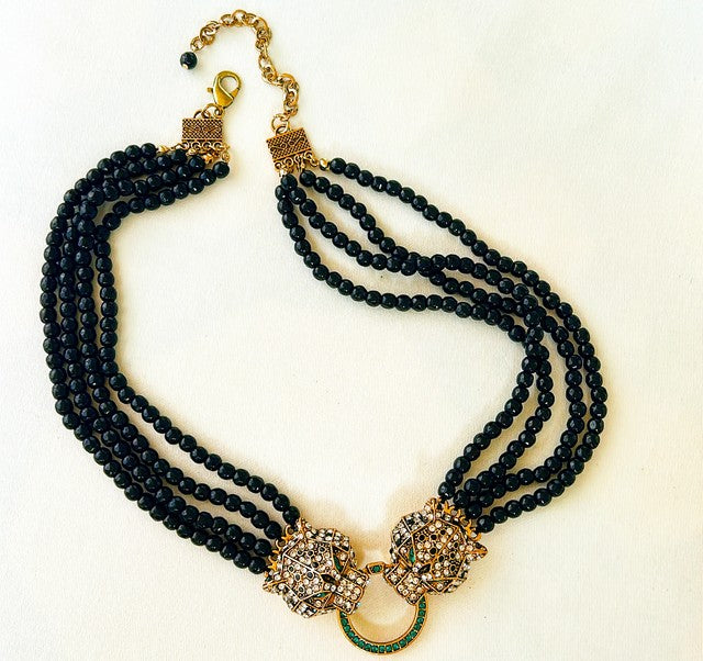 Striking statement double leopard necklace.