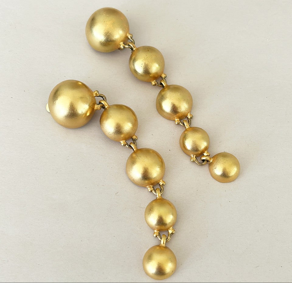 80s signed Ben Amun statement size gold ball dangling clip on earrings.