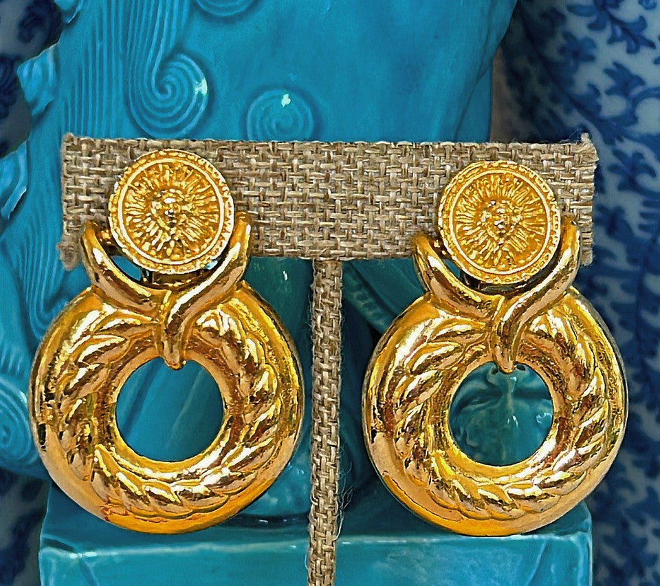 Large door knocker style early 90s clip on statement size earrings.