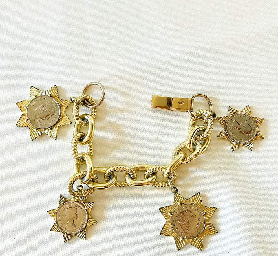 Fun coin charm bracelet stamped Coro.