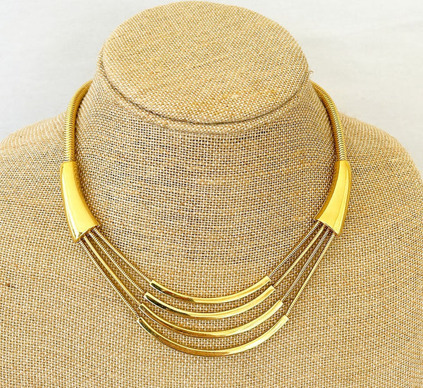1970s vintage signed MONET designer necklace in a gold tone metal finish