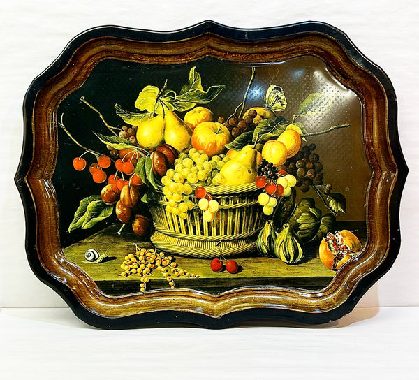 Vintage large scale metal tray of fruit in a basket with snail