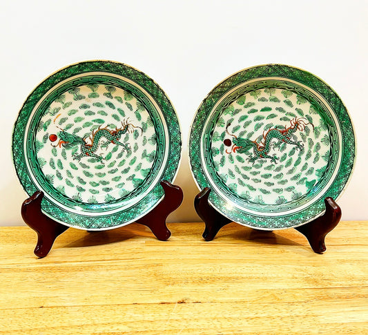 Pair of vintage green &amp; white chinoiserie dancing dragon plates / shallow bowls