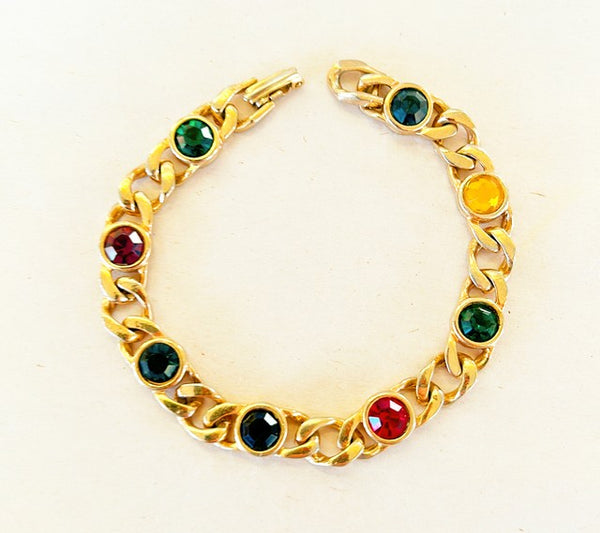 Vintage 90s multi colored faux gem stone link bracelet in a gold tone metal frame.