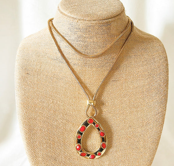 Vintage long gold tone metal flex style chain necklace with teardrop style pendant airy coral beaded stone accents.
