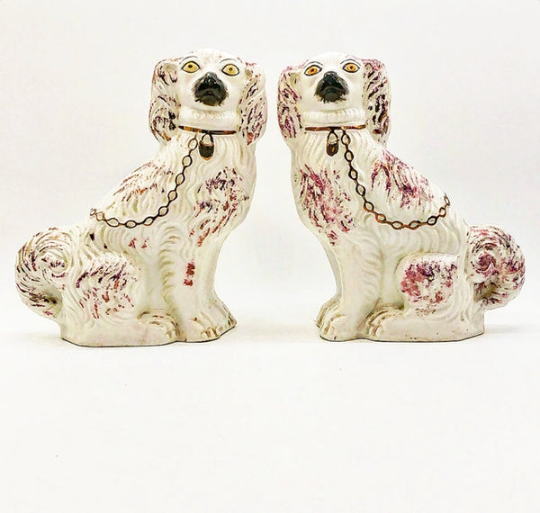 Antique stamped pair of left and right Staffordshire dogs.