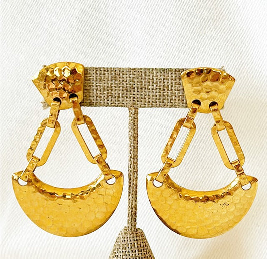 Large statement size pierced 80s earrings. Glamours look