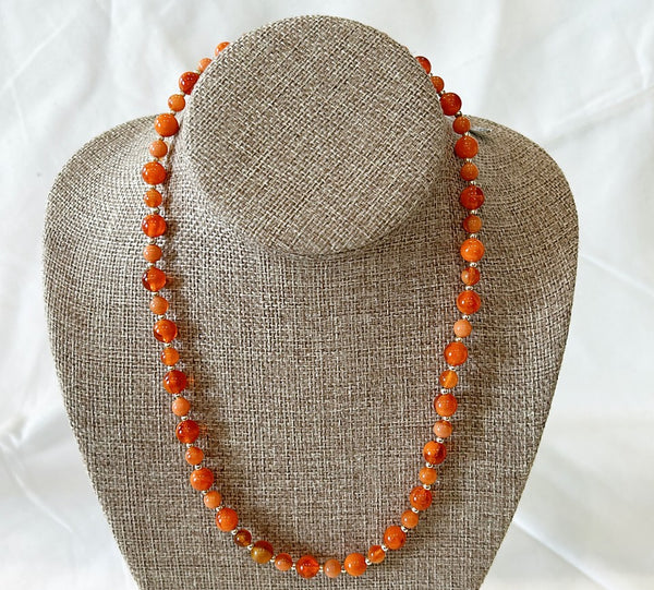 Orange genuine lucite tagged designer orange necklace.