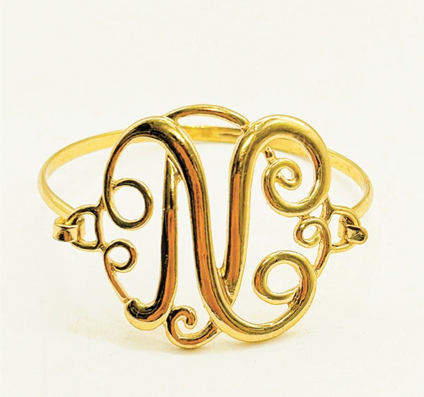 Vintage gold metal finished “N” monogrammed traditional bracelet.