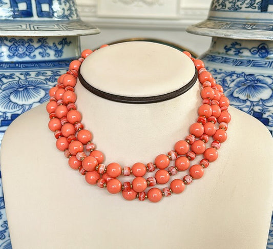 Beautiful coral colored beaded necklace from the 1960s.