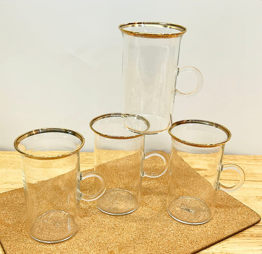 Set of 4 clear glass Irish Coffee style cups with round ring handles.