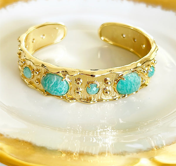 Designer style cuff bracelet with faux turquoise stone accents