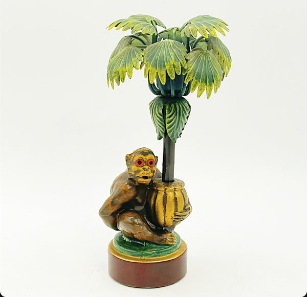 Vintage painted metal tole monkey under palm tree candlestick.