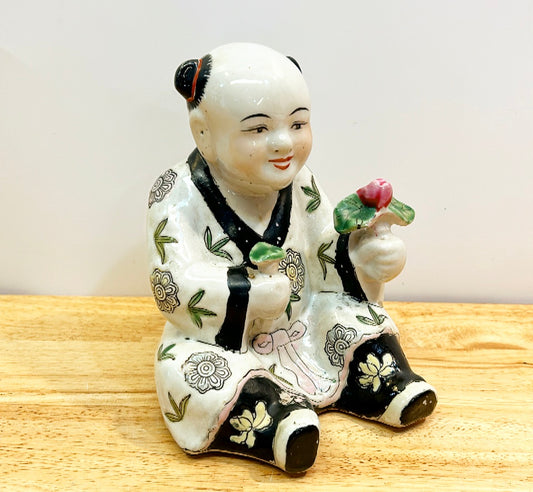 Vintage 80s Chinese export of Asian child holding flower.