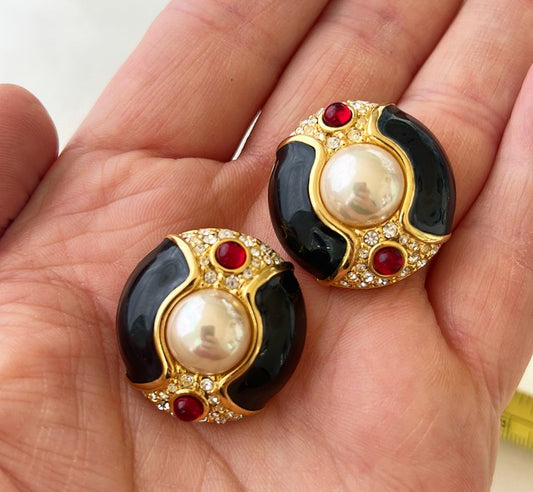 Vintage signed Nolan Miller clip style faux pearl earrings.