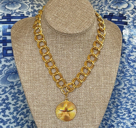 Fabulous thick gold metal chain with star pendant.