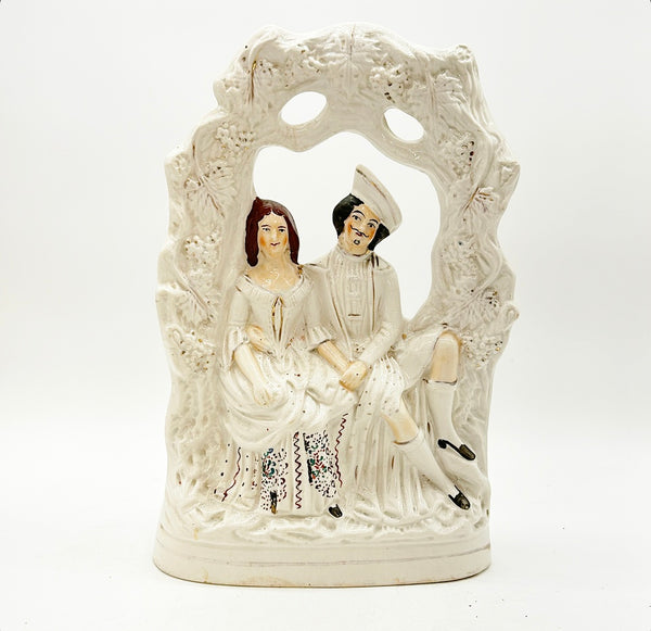 Antique large scale English Staffordshire couple figure.