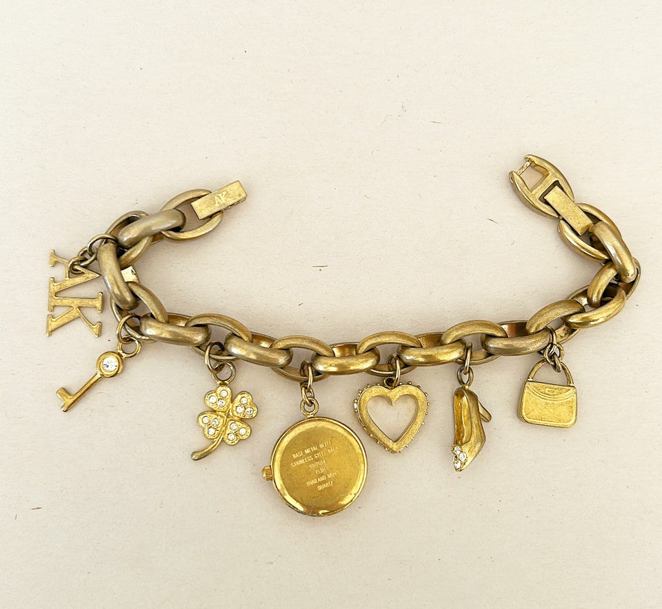 Rare signed Anne Klein charm bracelet with Anne Klein watch charm.