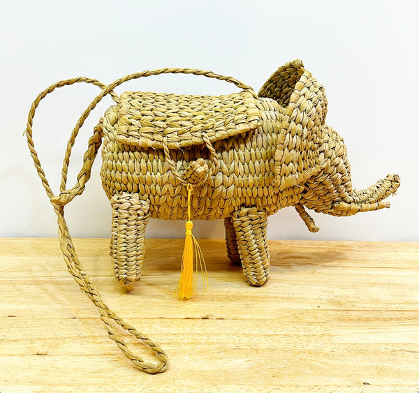 Fun woven elephant purse with yellow tassel.