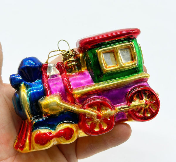 Vintage hand blown glass Christmas tree ornament in the shape of a train.