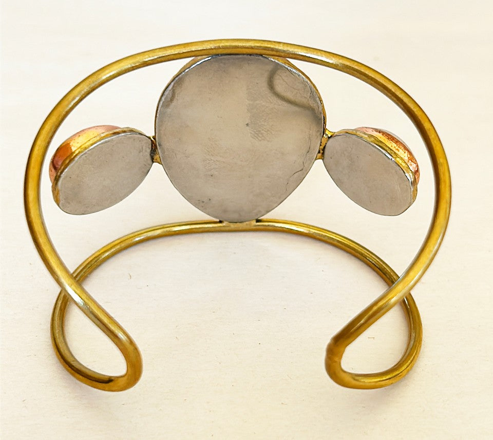 Modern style designer cuff with brass frame with sodalite stone mixed with moonstones.