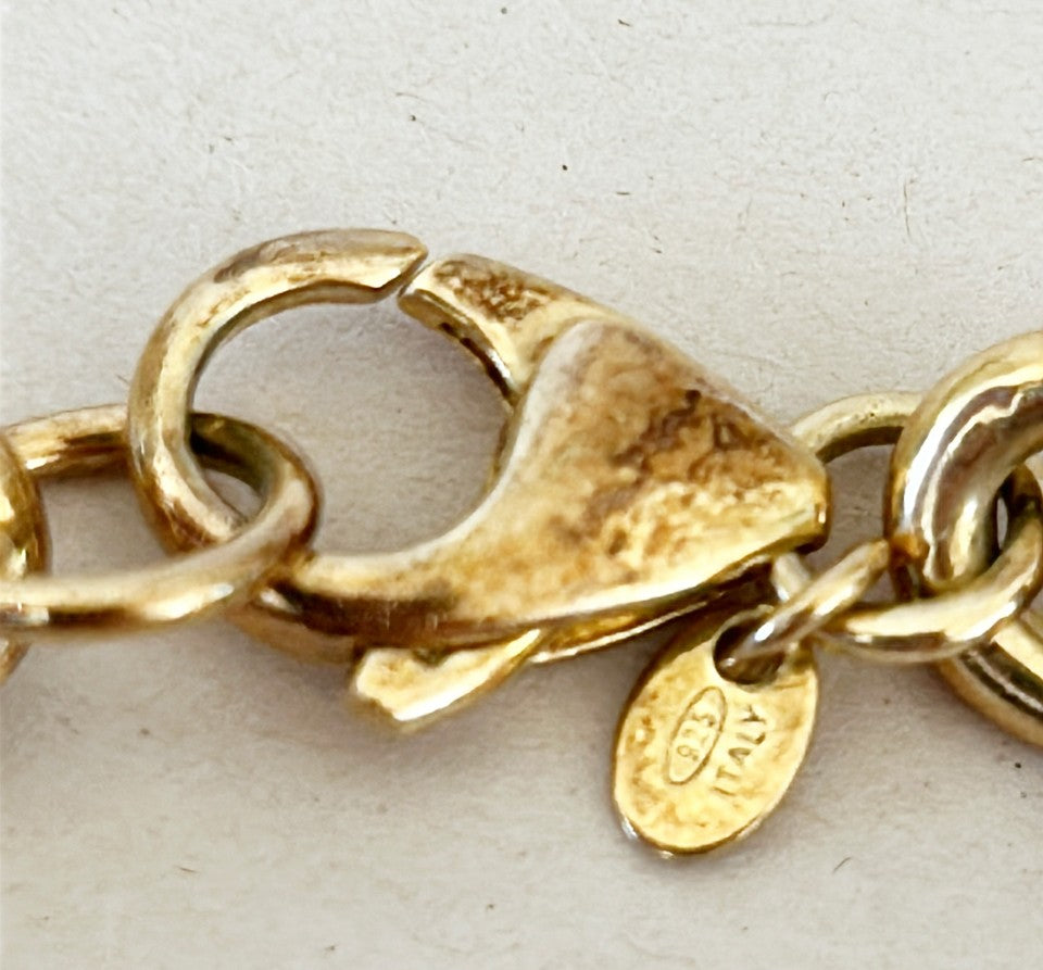 Amazing vintage Italian 18k gold over silver stamped Italian coin charm bracelet.