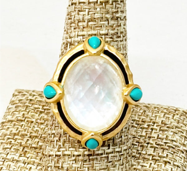 Large cocktail ring with large center oval faux mother of pearl and side faux turquoise pear shadows stone accents