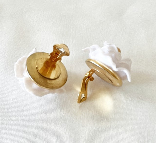 Larger scale vintage clip on designer looking clip earrings.