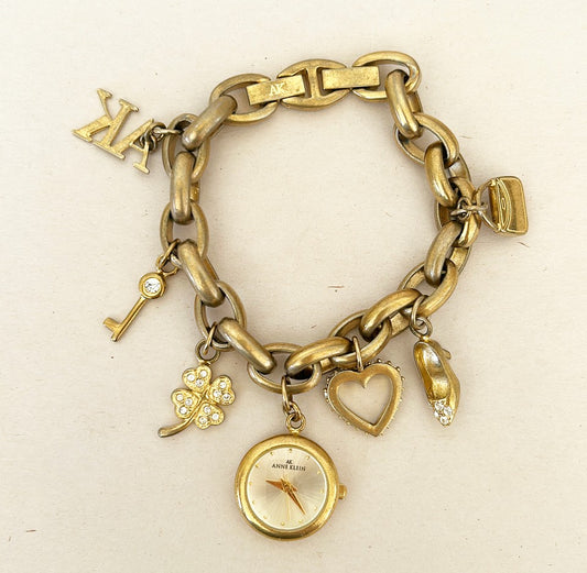Rare signed Anne Klein charm bracelet with Anne Klein watch charm.