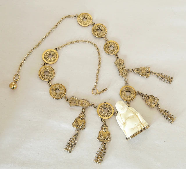 Vintage mid century modern 1960s signed Trifari Chinese faux carved Buddha coin necklace.