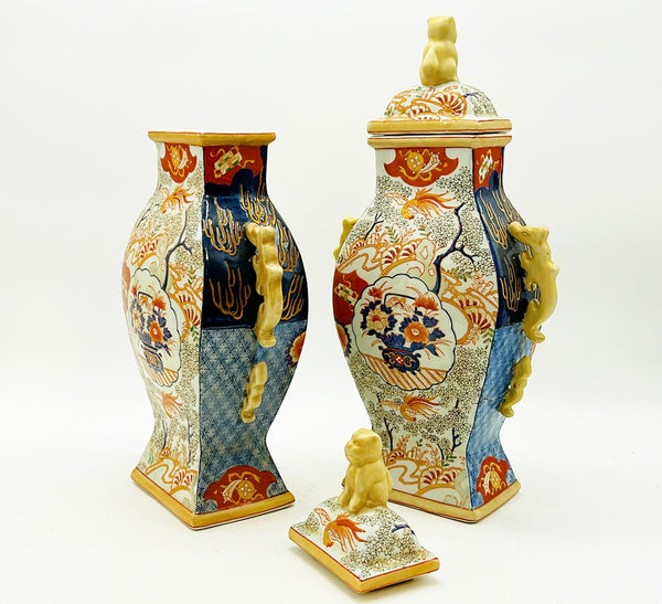 Pair of vintage Imari style vases with foo dog style lids.