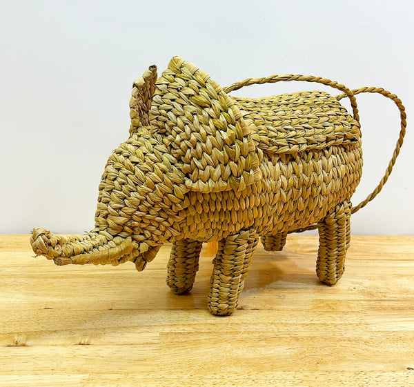 Fun woven elephant purse with yellow tassel.