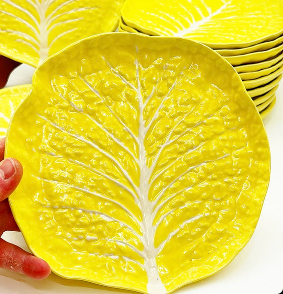 Amazing large 14 piece matching set of vintage yellow cabbage ware plates.