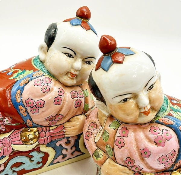 Pair of vintage left and right Asian style figure boxes.