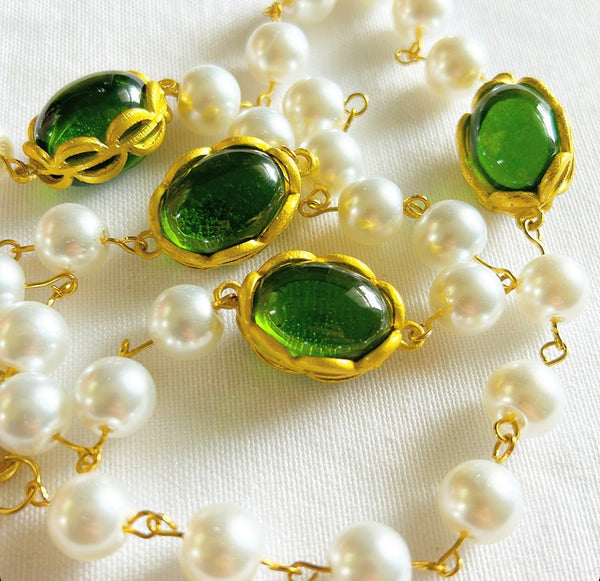 Classic faux pearl ling necklace with large oval shaped green gripoix style stones with gold metal accents