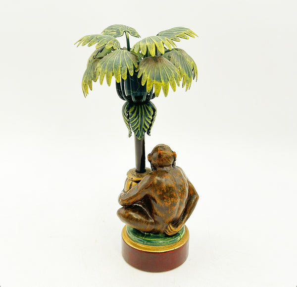 Vintage painted metal tole monkey under palm tree candlestick.