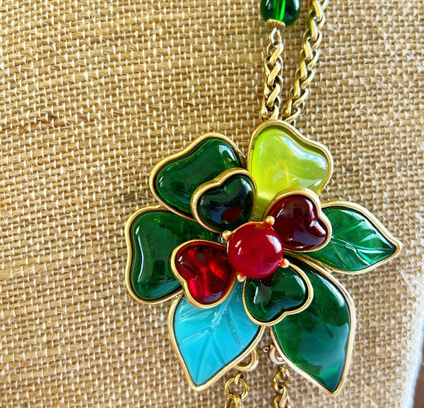 Beautiful statement necklace with large flower style attached pendant.