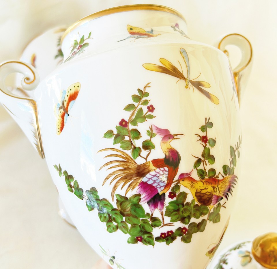 Pair of 19th century Limoges signed neoclassical urns with lids.
