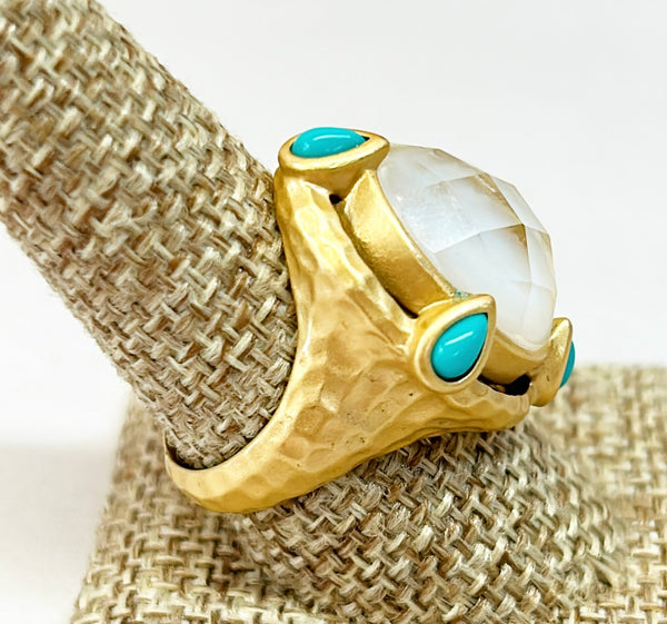 Large cocktail ring with large center oval faux mother of pearl and side faux turquoise pear shadows stone accents