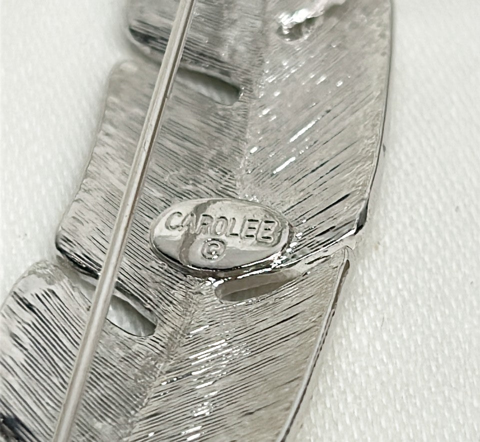 Classic signed Carolee rhinestone encrusted feather designer brooch.