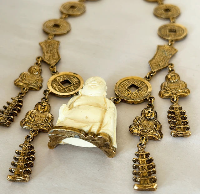 Vintage mid century modern 1960s signed Trifari Chinese faux carved Buddha coin necklace.